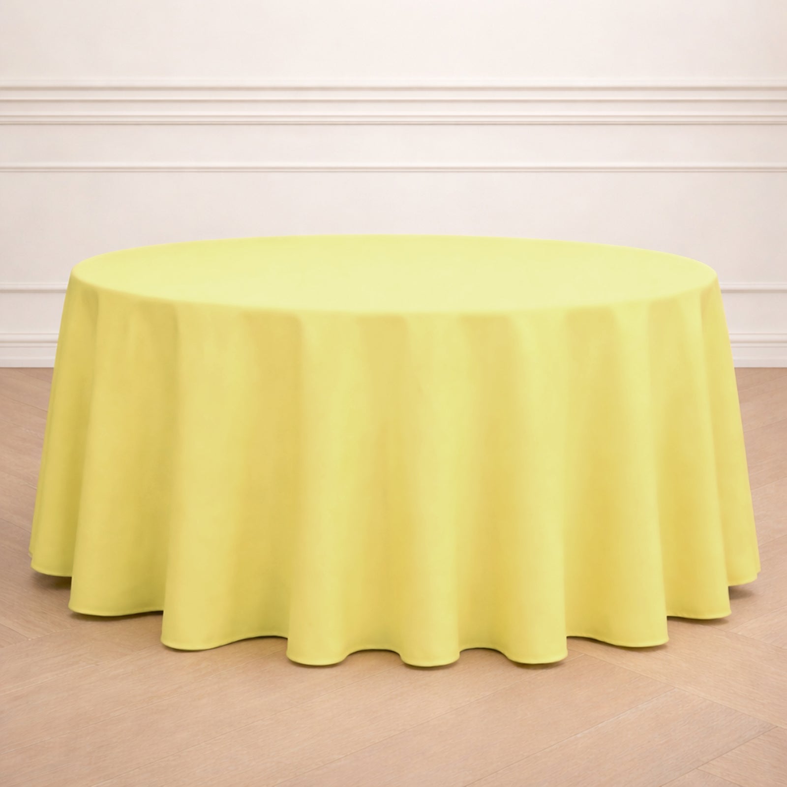 Yellow round polyester tablecloth, 120 inches in size.
