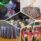Red and white striped satin tablecloth on various tables.