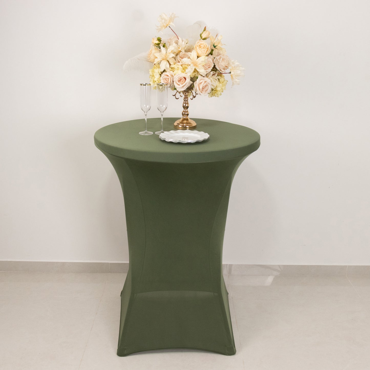 Dusty sage green fitted cocktail table cover on a high top table.