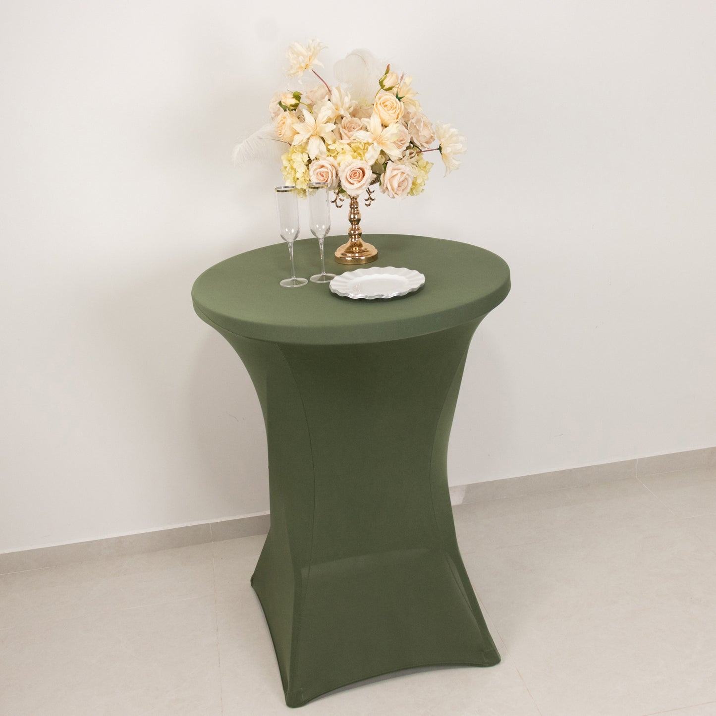 Dusty sage green fitted cocktail table cover on high top table.