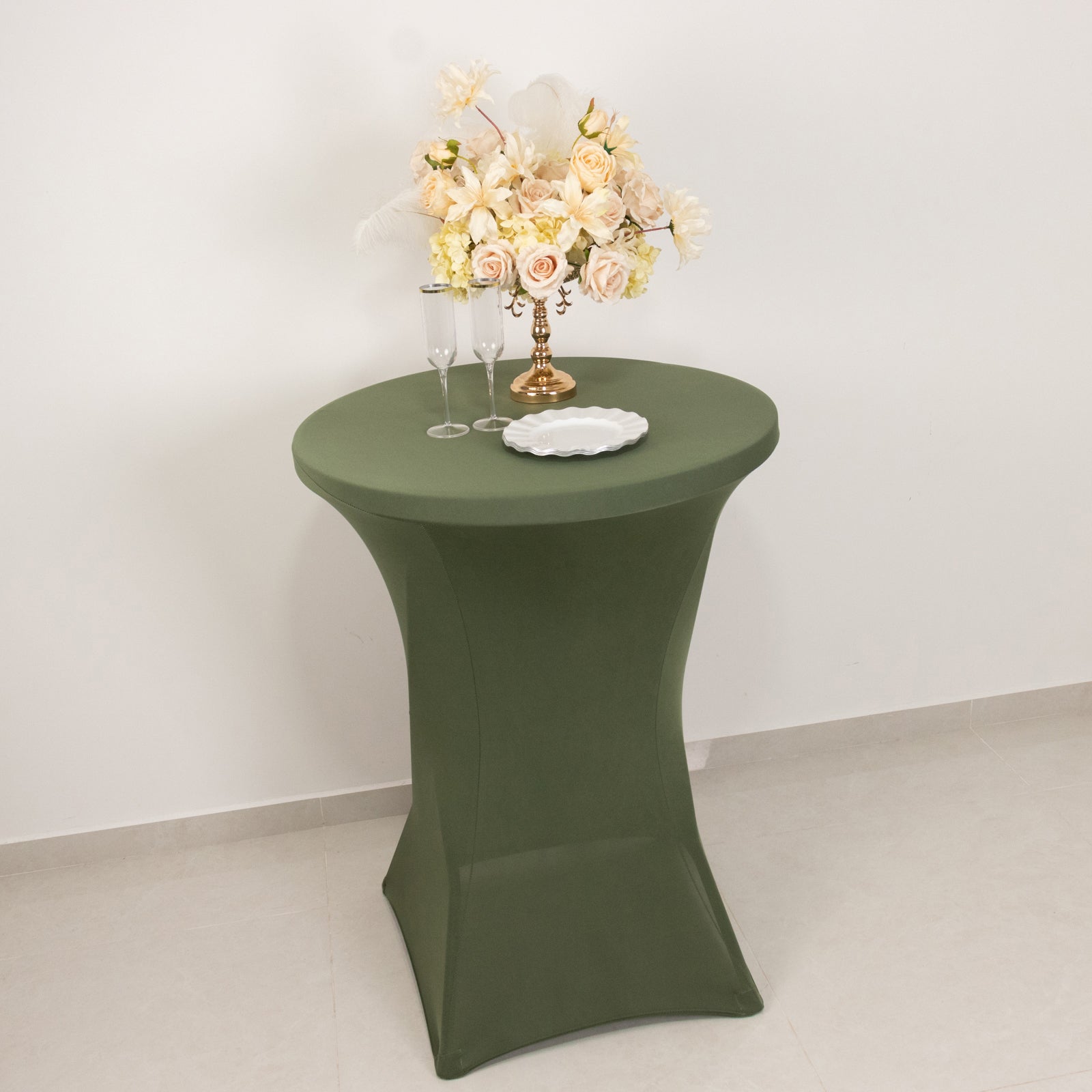Dusty sage green fitted cocktail table cover on high top table.