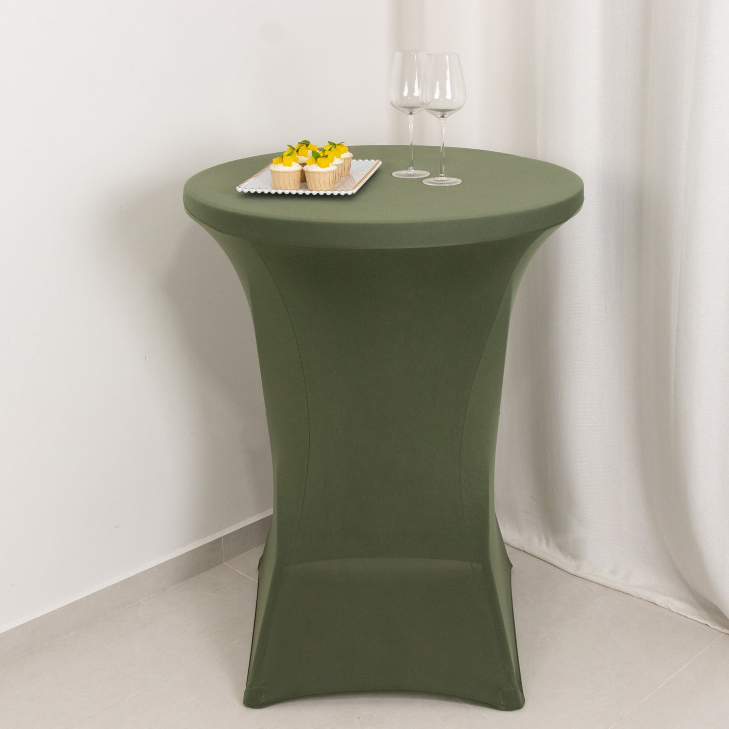 Dusty sage green fitted table cover for high top cocktail tables.