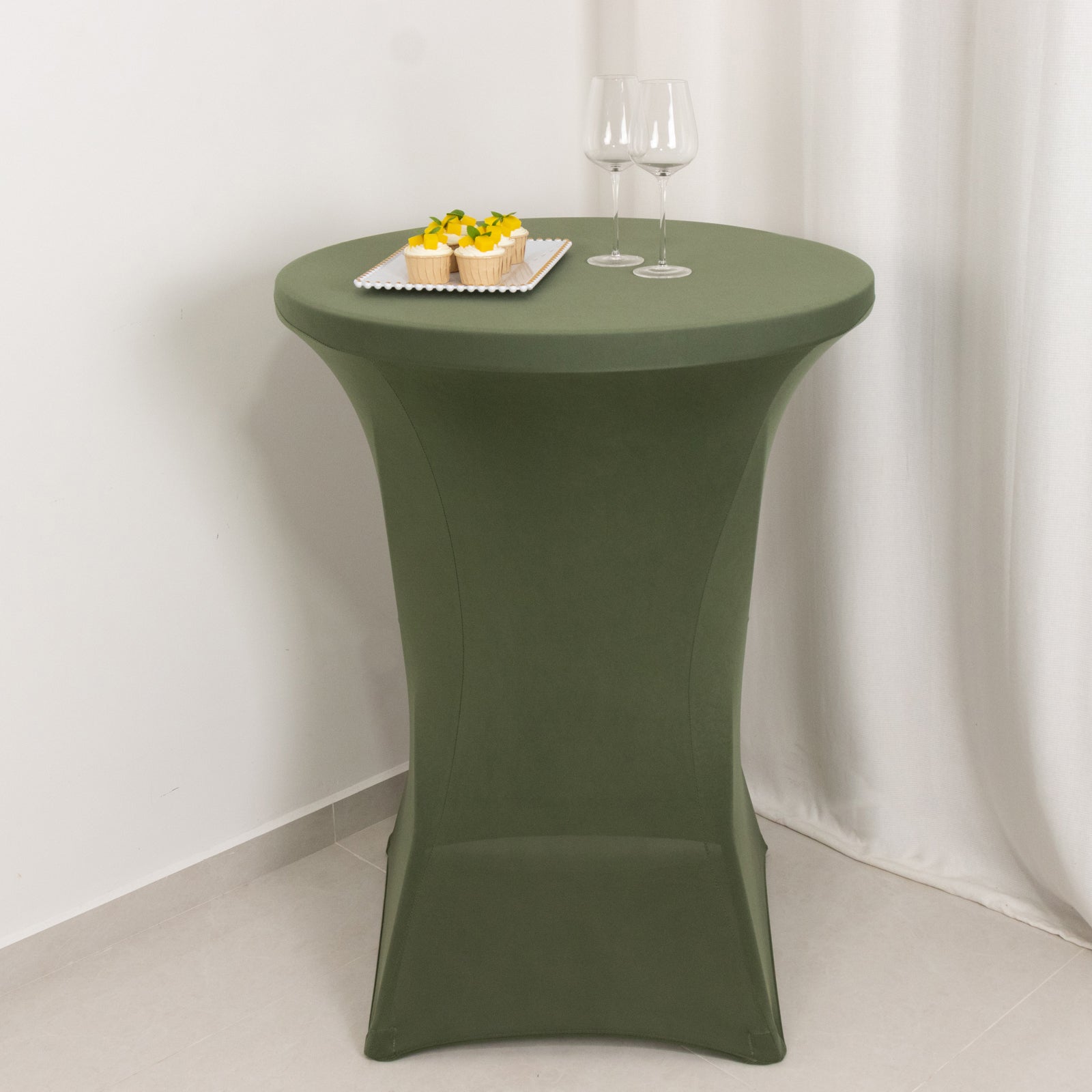 Dusty sage green fitted table cover for high top cocktail tables.