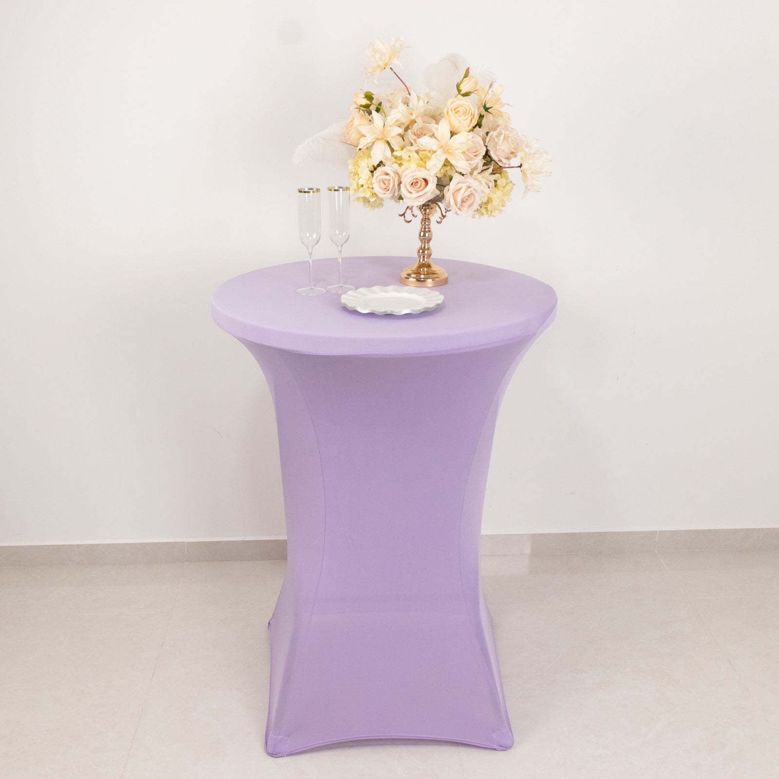 Lavender highboy spandex cocktail table cover with floral arrangement.