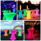 Glow neon fuchsia spandex cocktail tablecloth on round tables.