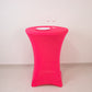 Glow Neon Fuchsia Fitted Spandex Cocktail Tablecloth on a round table.