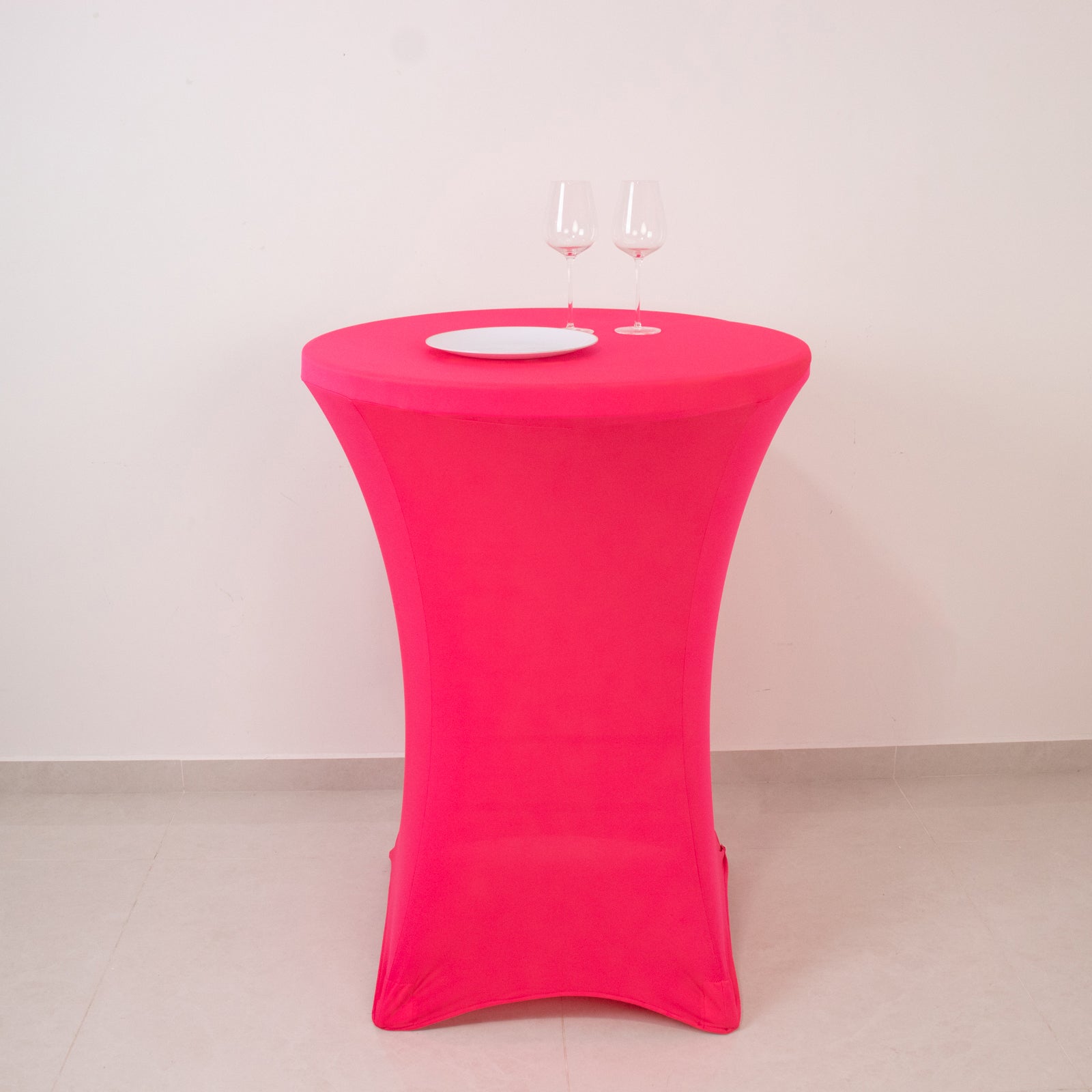 Glow Neon Fuchsia Fitted Spandex Cocktail Tablecloth on a round table.