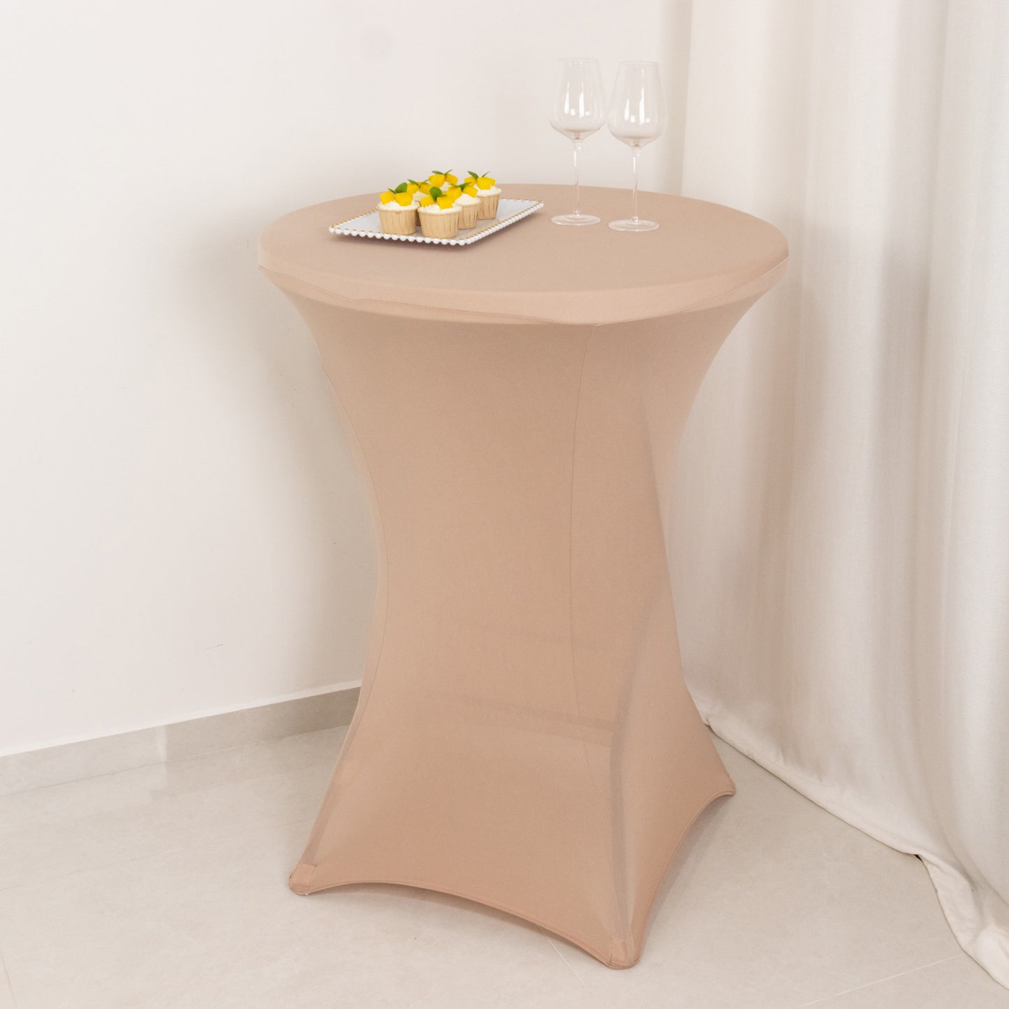 Nude fitted spandex cocktail table cover for high top tables.