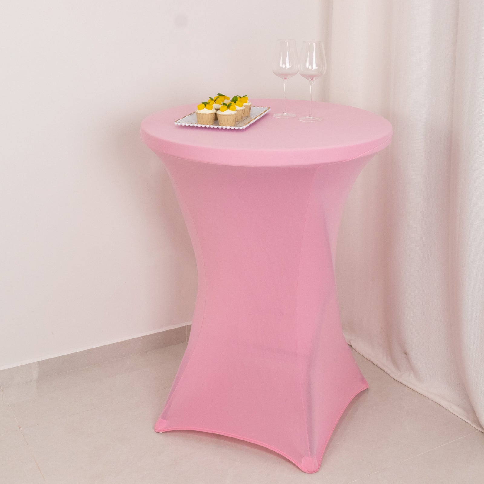Pink fitted stretch tablecloth for 30" high top cocktail tables.