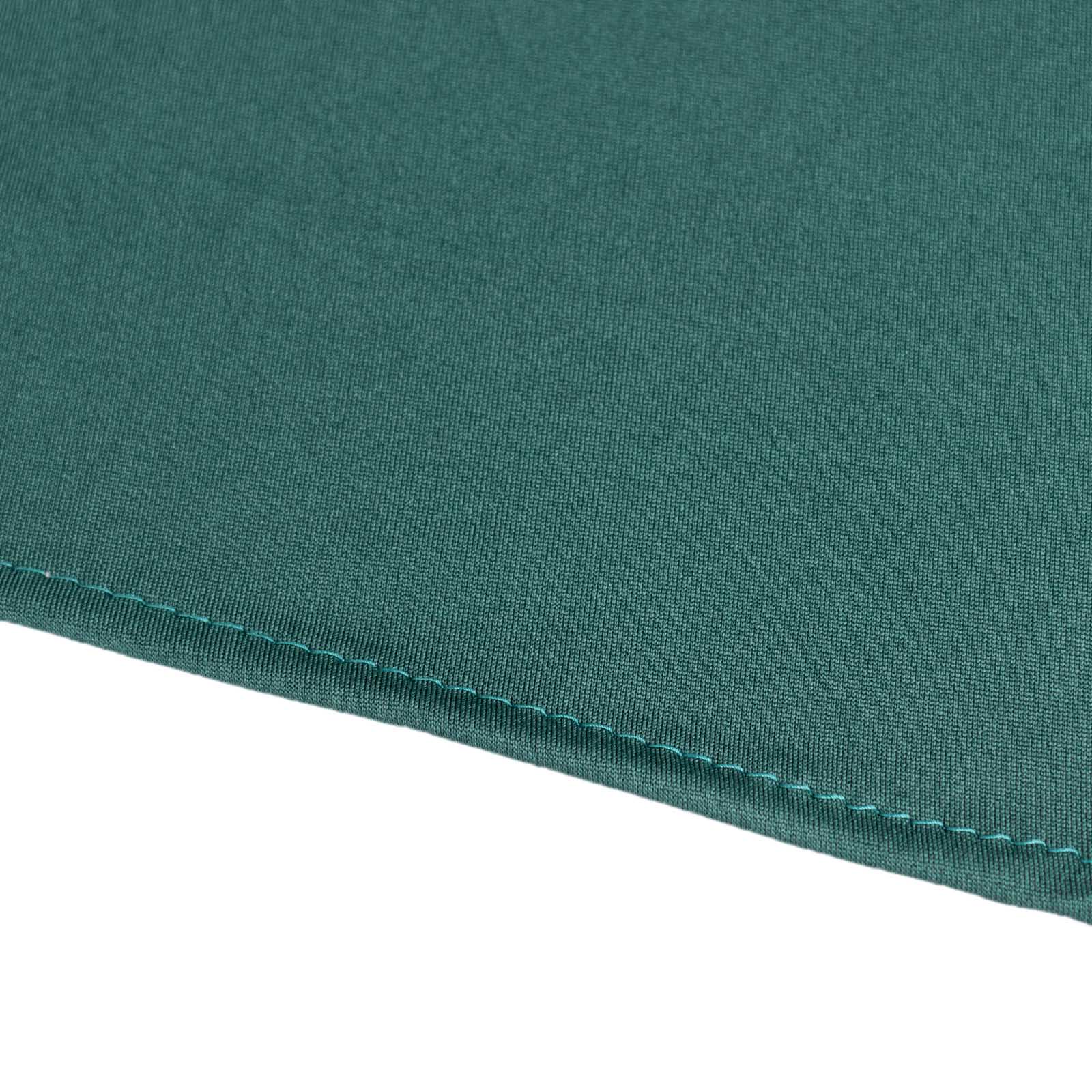 Hunter emerald green cocktail table cover skirt with wavy drapes.