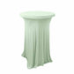 Sage green round cocktail table cover with wavy drapes.