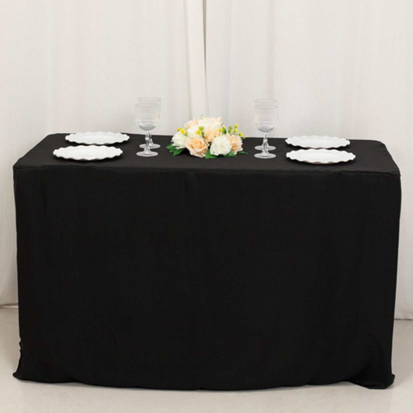 Black fitted tablecloth for 48"x24"x30" tables with elegant table setting.
