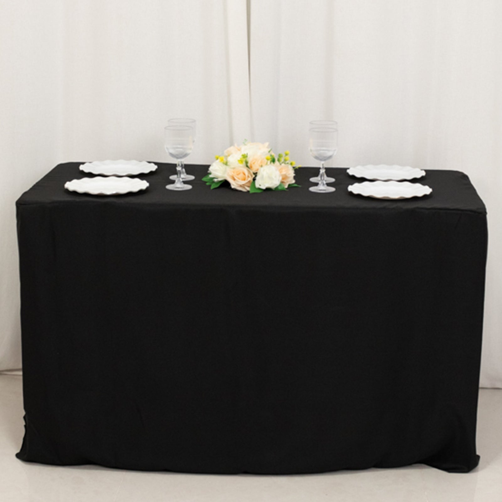Black fitted tablecloth for 48"x24"x30" tables with elegant table setting.