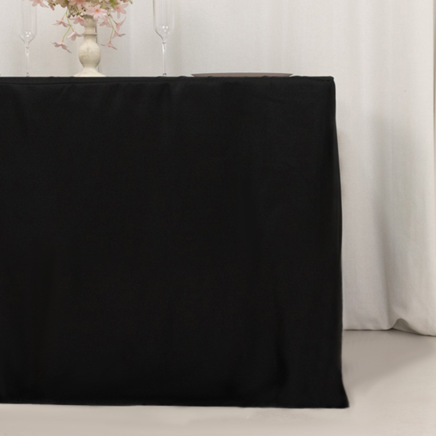 Black fitted polyester tablecloth for 48"x24"x42" tables.