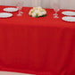 Red fitted polyester tablecloth for 72"x30" table at a trade show.