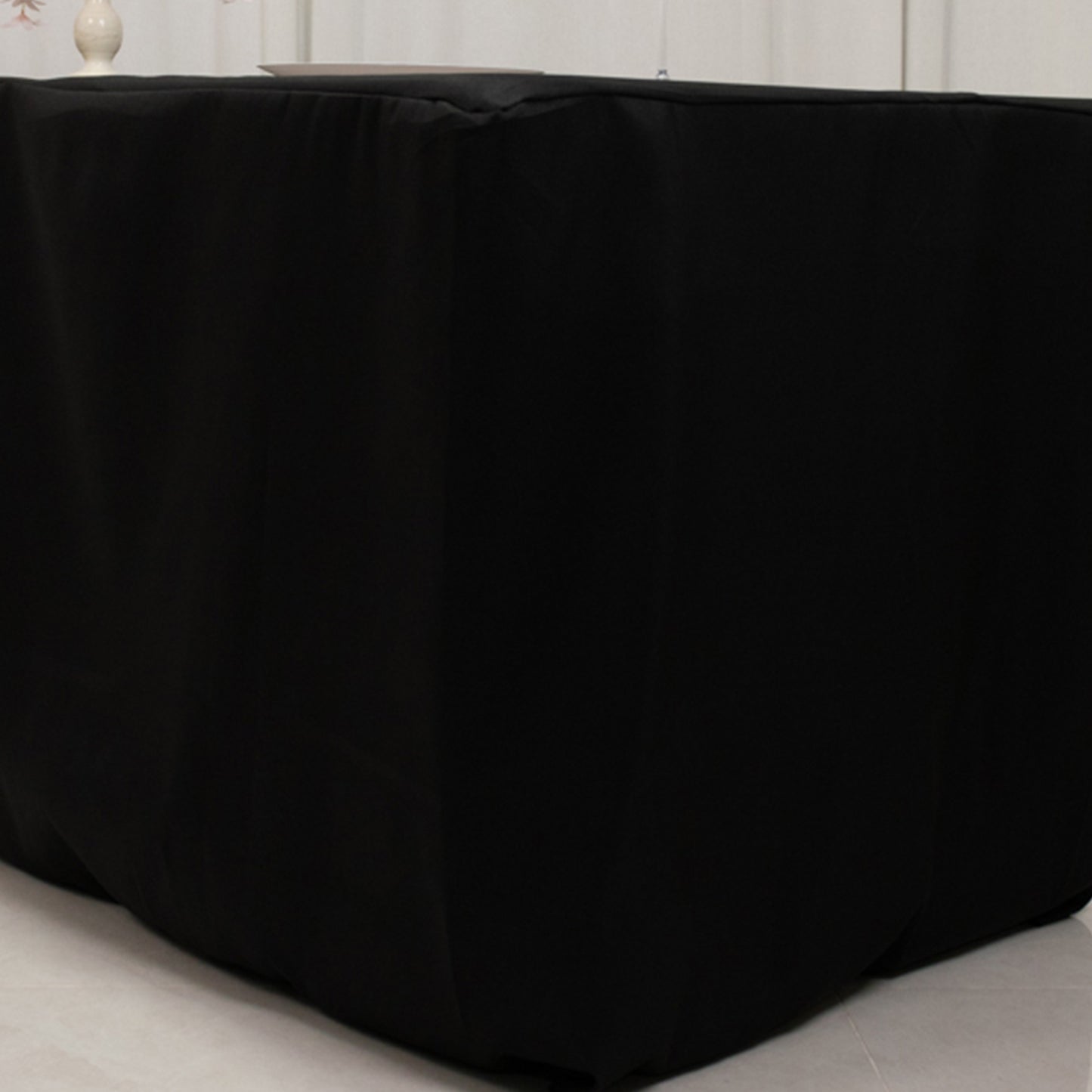Black fitted polyester tablecloth for 96"x24"x30" tables.