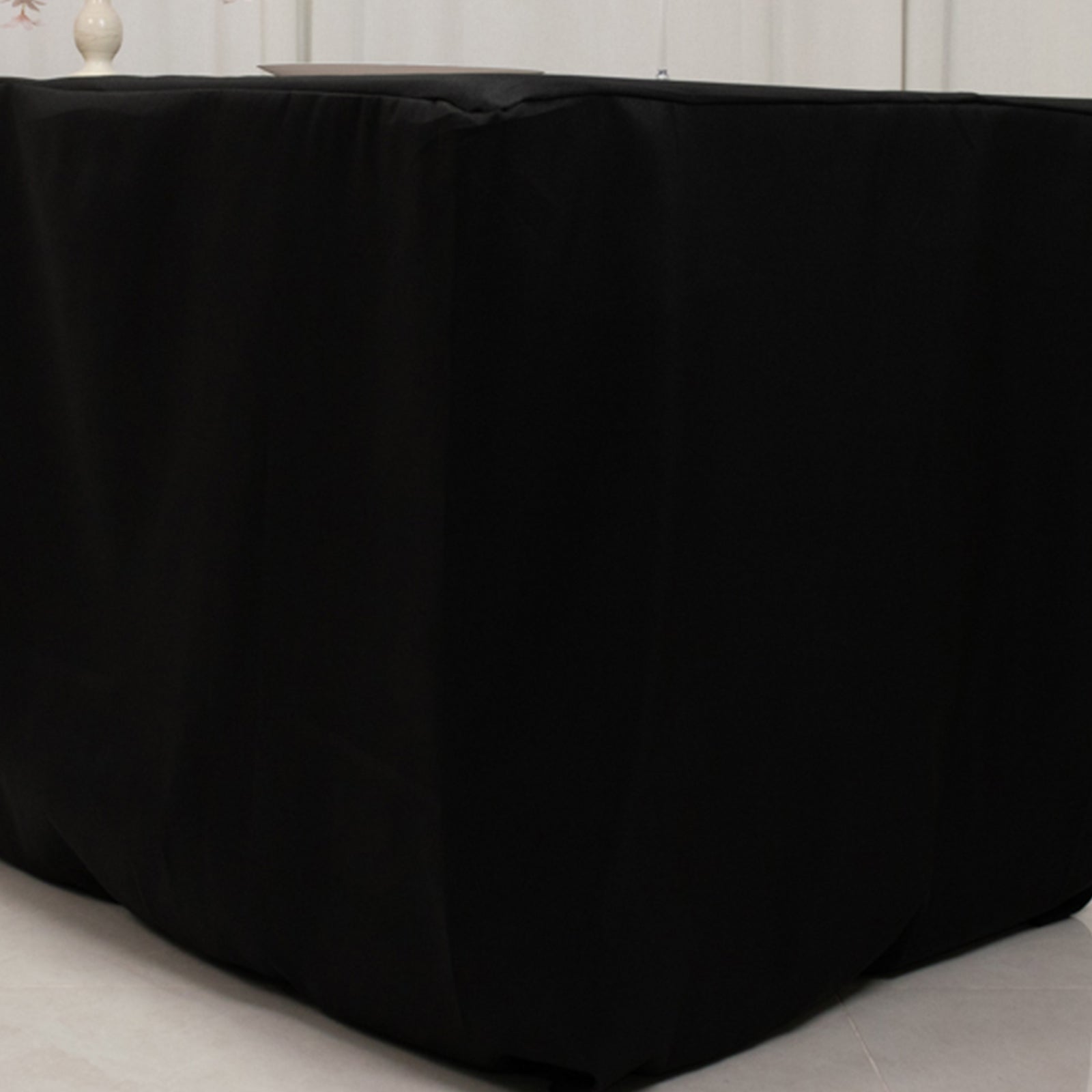 Black fitted polyester tablecloth for 96"x24"x30" tables.