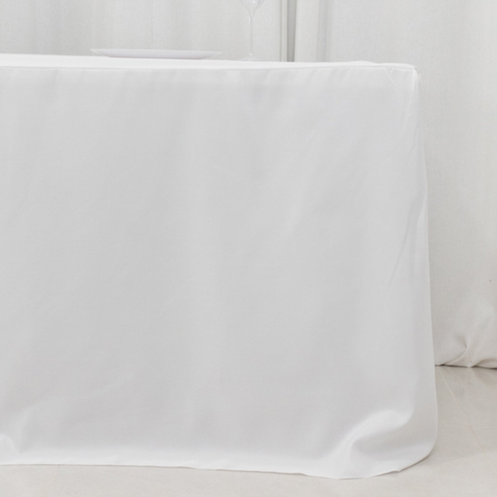 White fitted polyester tablecloth for 8ft rectangle tables.