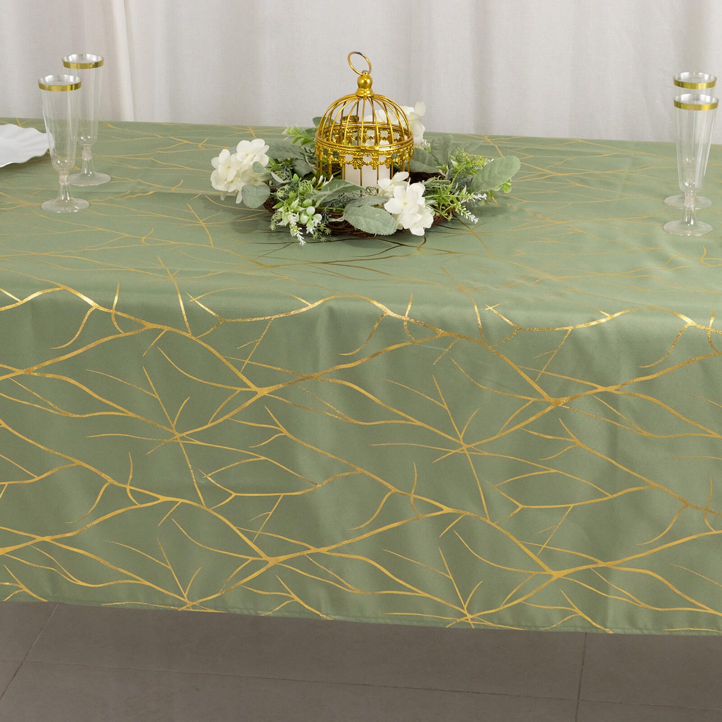 Dusty sage green tablecloth with gold foil tree branch pattern, 60"x102".