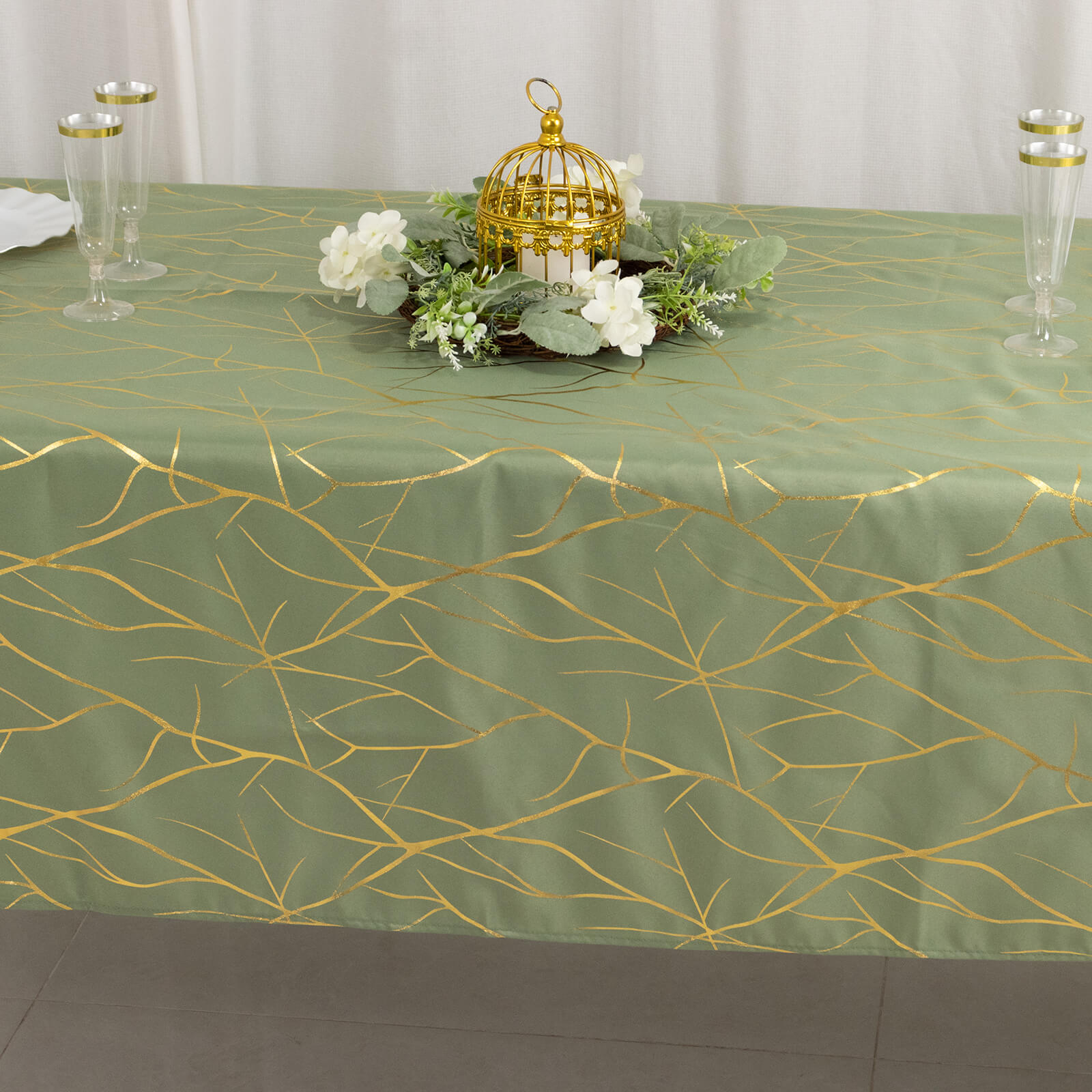 Dusty sage green tablecloth with gold foil tree branch pattern, 60"x102".
