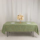 Dusty sage green tablecloth with gold foil tree branch pattern.