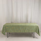 Dusty sage green tablecloth with gold foil tree branch pattern.