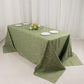 Dusty sage green tablecloth with gold foil tree branch pattern on a 6-foot table.