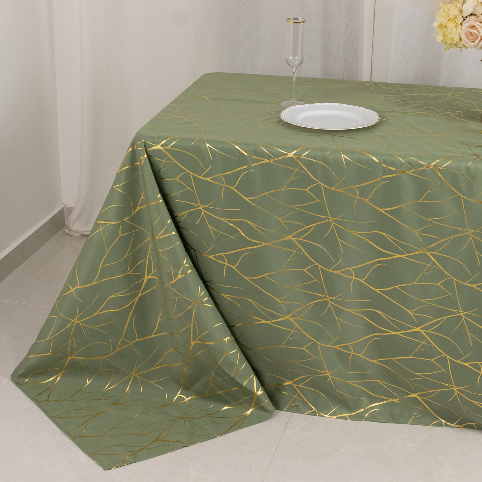 Dusty sage green tablecloth with gold foil tree branch pattern for 6-foot table.