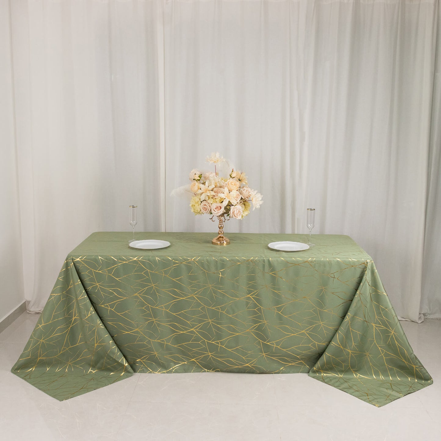 Dusty sage green tablecloth with gold foil tree branch pattern for 6-foot table.