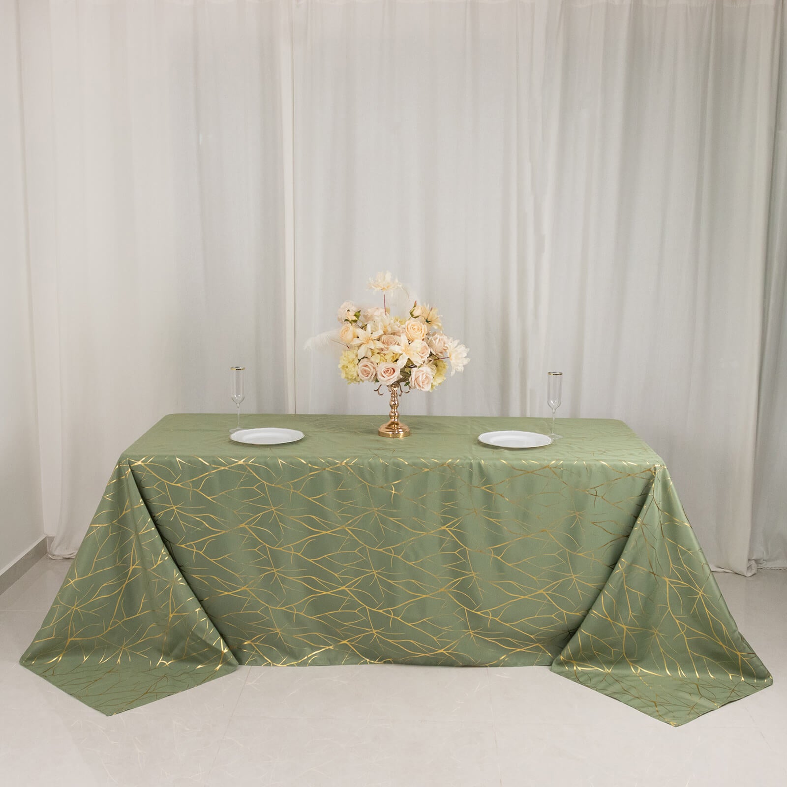 Dusty sage green tablecloth with gold foil tree branch pattern for 6-foot table.