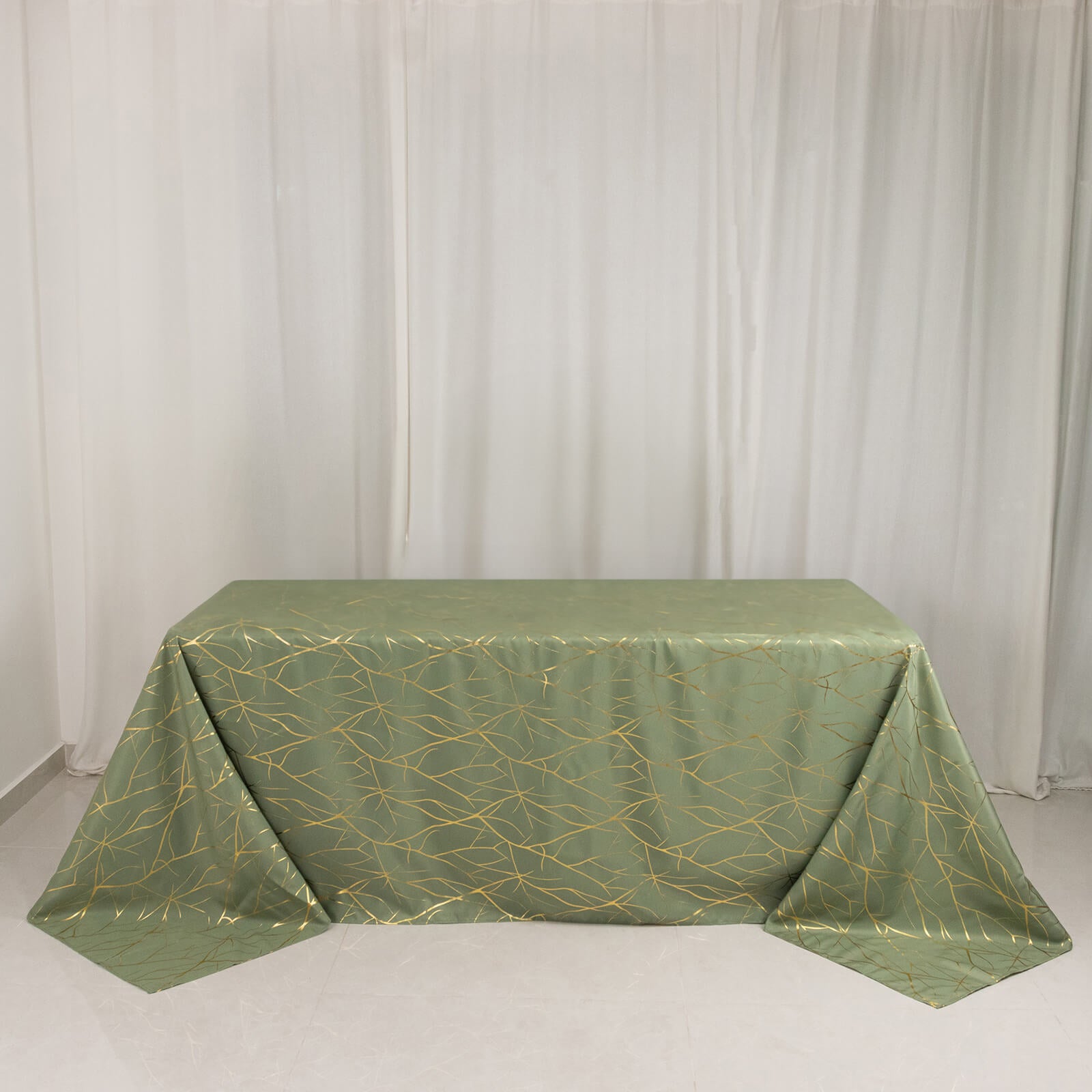 Dusty sage green tablecloth with gold foil tree branch pattern for 6-foot table.