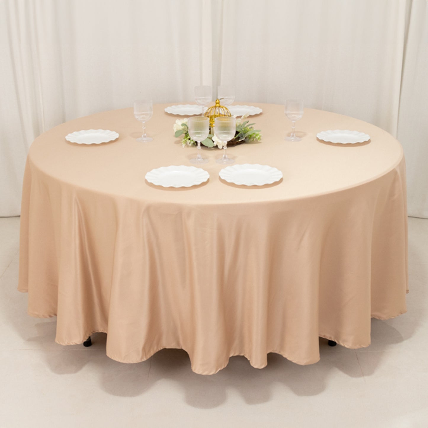 Nude round satin tablecloth perfect for elegant dining settings.