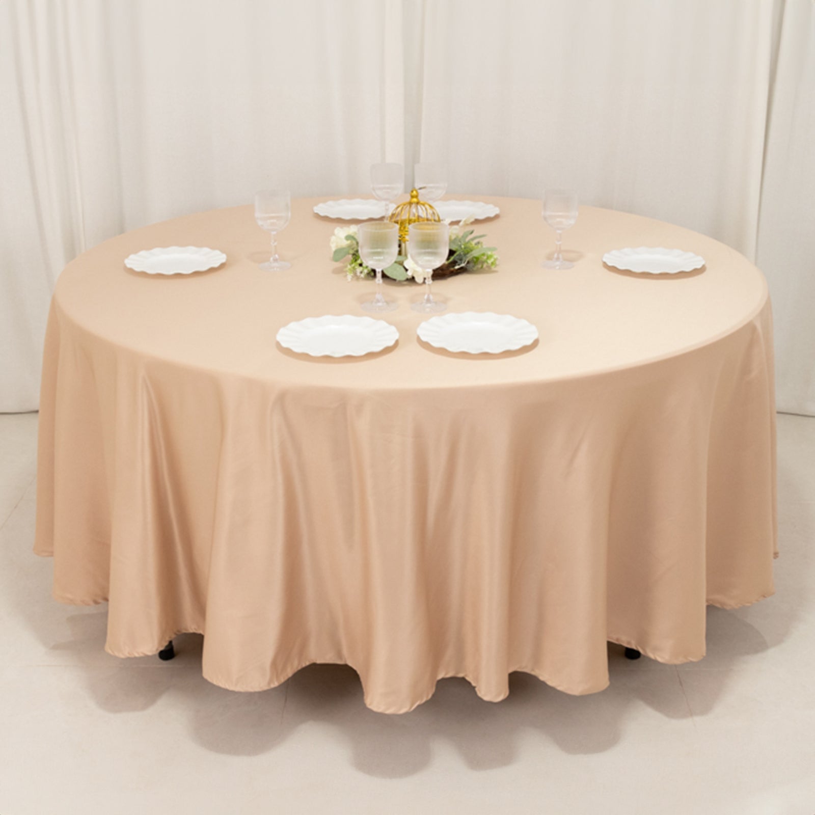 Nude round satin tablecloth perfect for elegant dining settings.