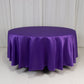 Purple satin round tablecloth on a white background.