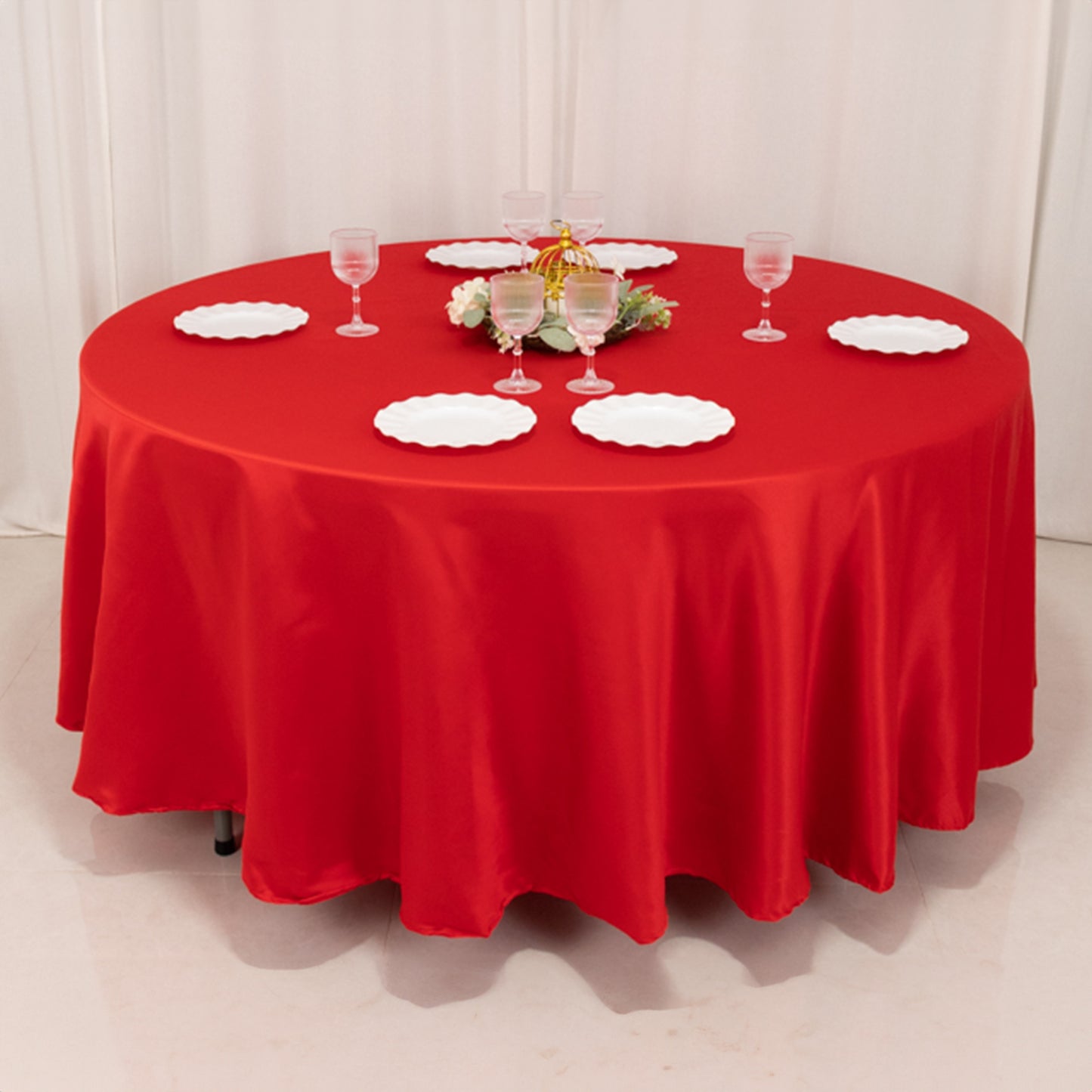 Red round tablecloth for elegant table settings.