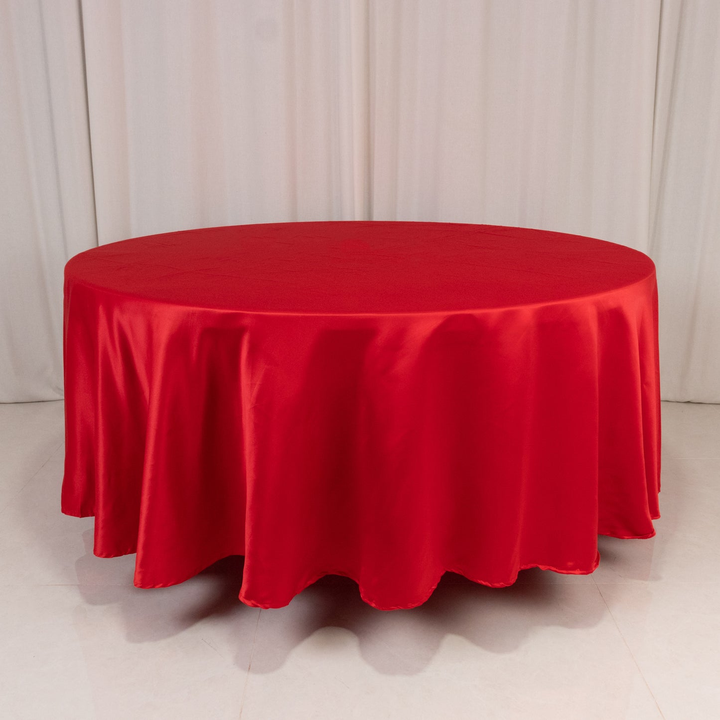 Red satin round tablecloth, 108 inches in diameter.