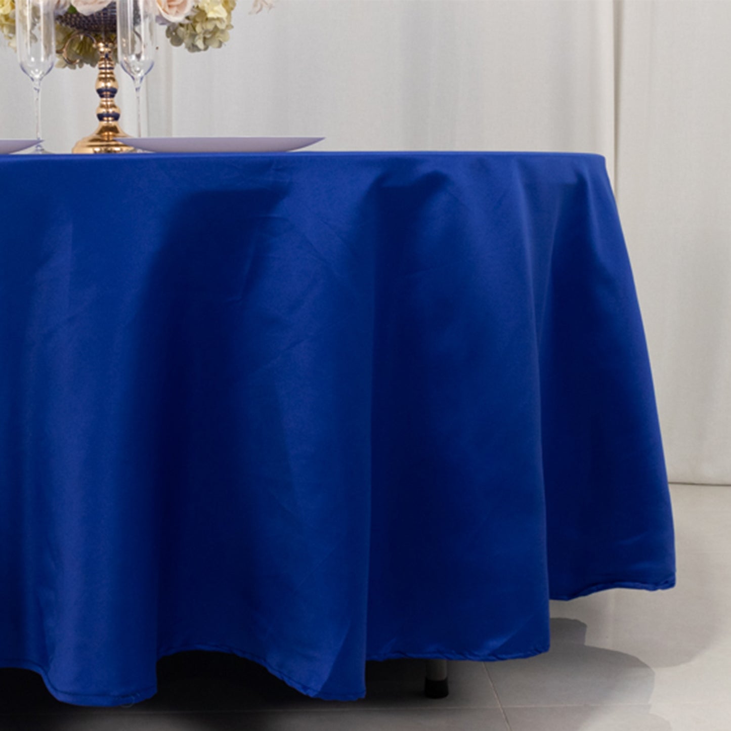 108" Royal Blue Satin Round Tablecloth on a dining table