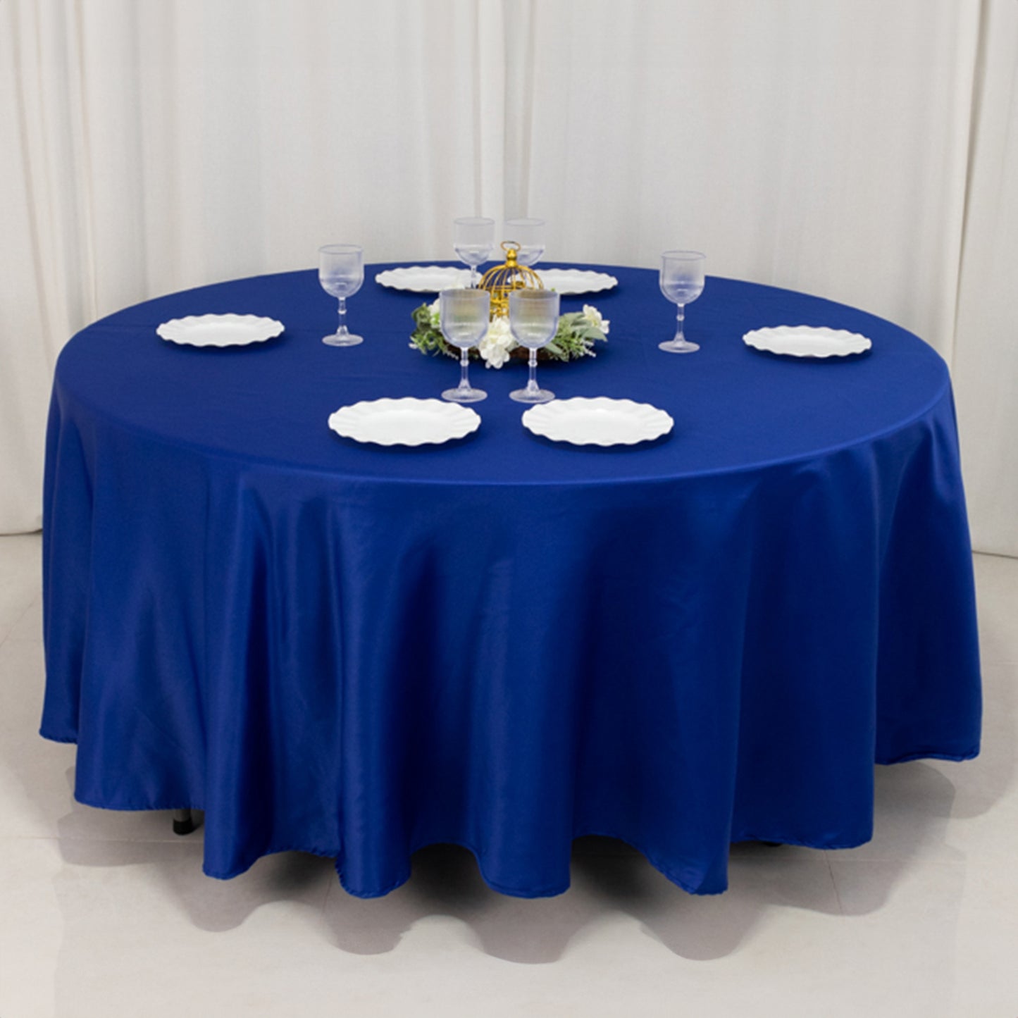 Royal Blue Lamour Satin Round Tablecloth on a dining table.