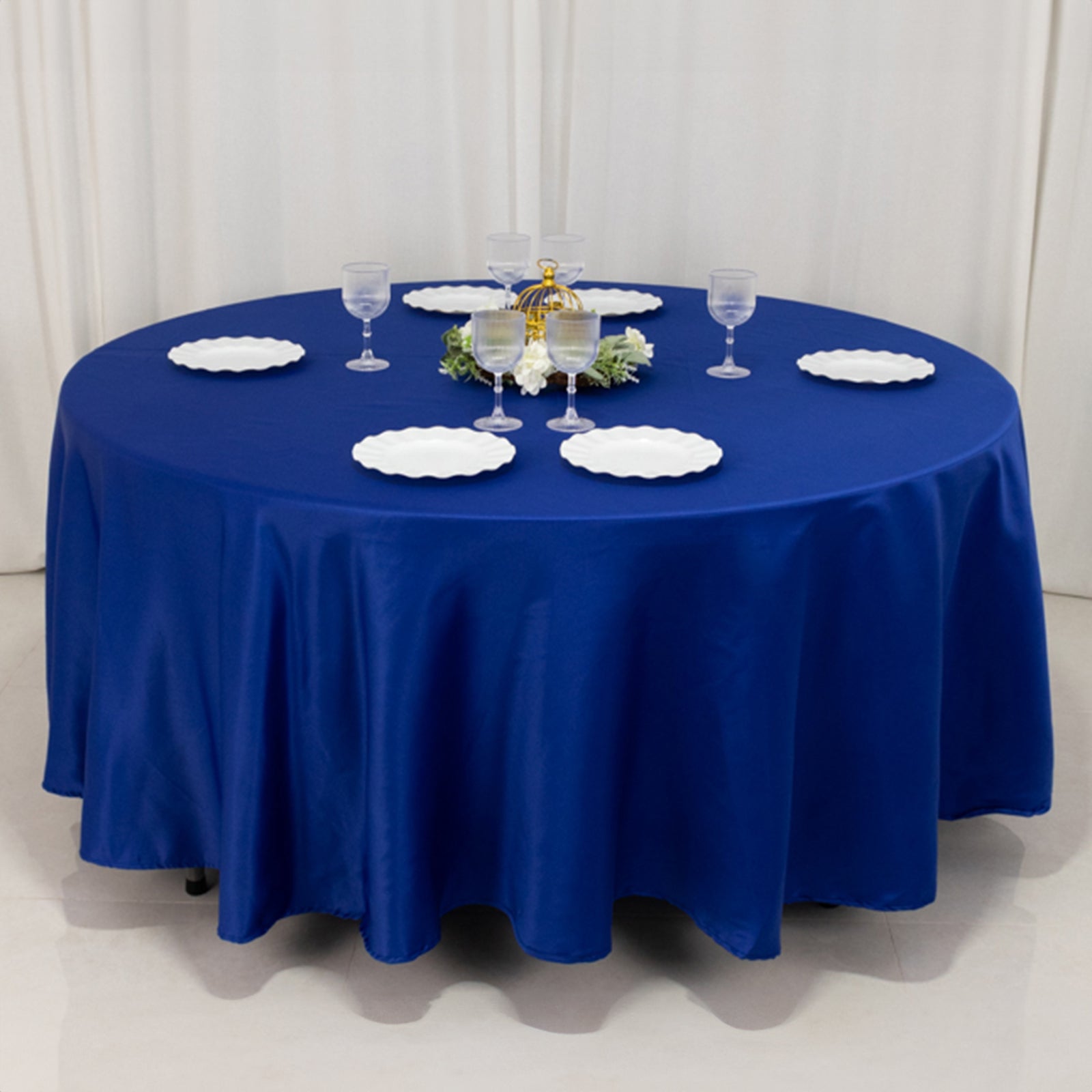 Royal Blue Lamour Satin Round Tablecloth on a dining table.