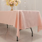 Blush satin rectangle tablecloth draping elegantly over a table.
