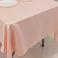 Blush Lamour Satin Rectangle Tablecloth on a dining table.