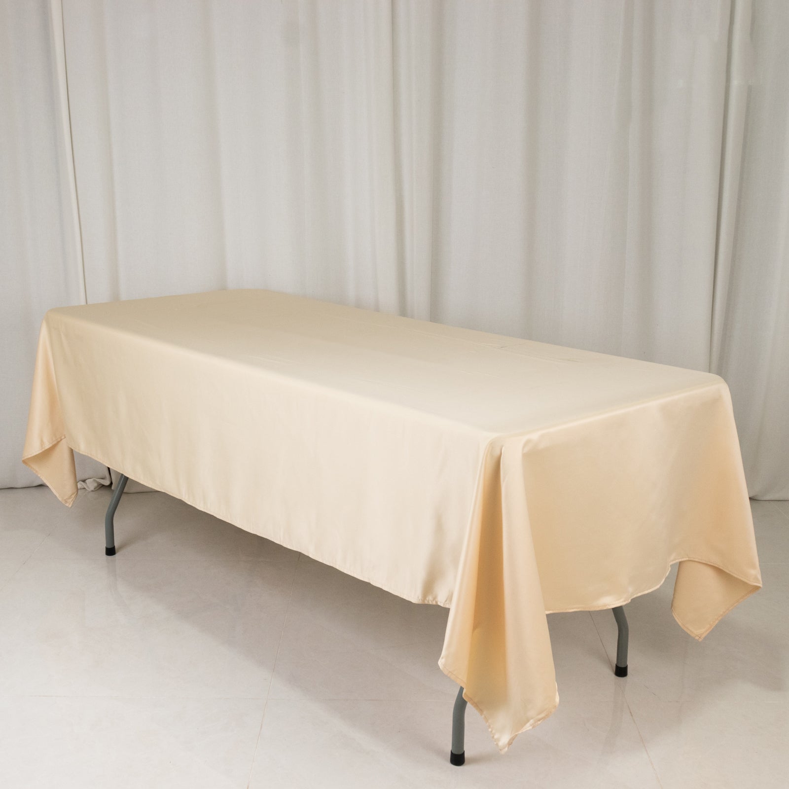 Beige satin rectangle tablecloth, 60"x102" size.