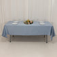 Dusty blue satin rectangle tablecloth on a table set for dining.