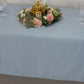 Dusty blue satin rectangle tablecloth with floral centerpiece.