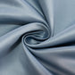 Dusty blue satin tablecloth fabric in a swirling pattern.