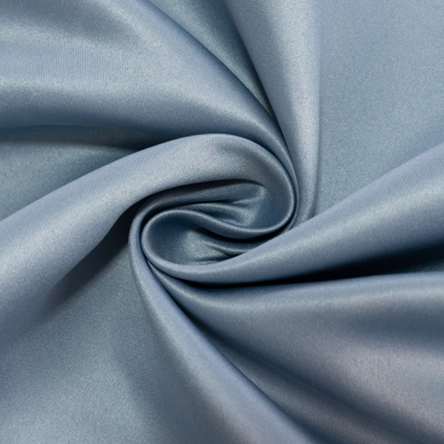 Dusty blue satin tablecloth fabric in a swirling pattern.