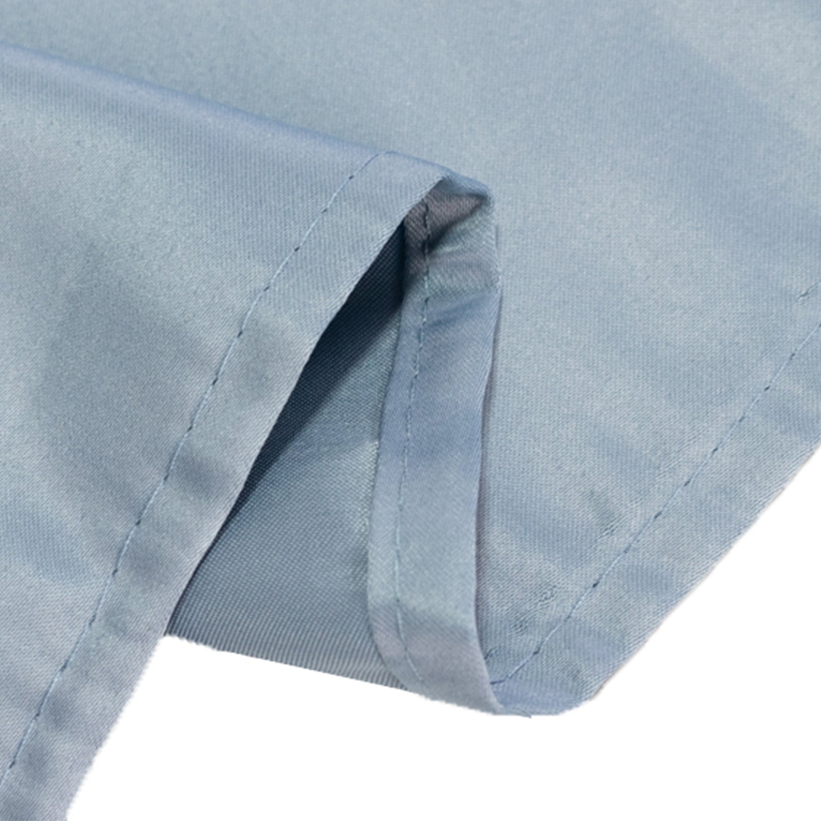 Dusty blue satin tablecloth corner detail.