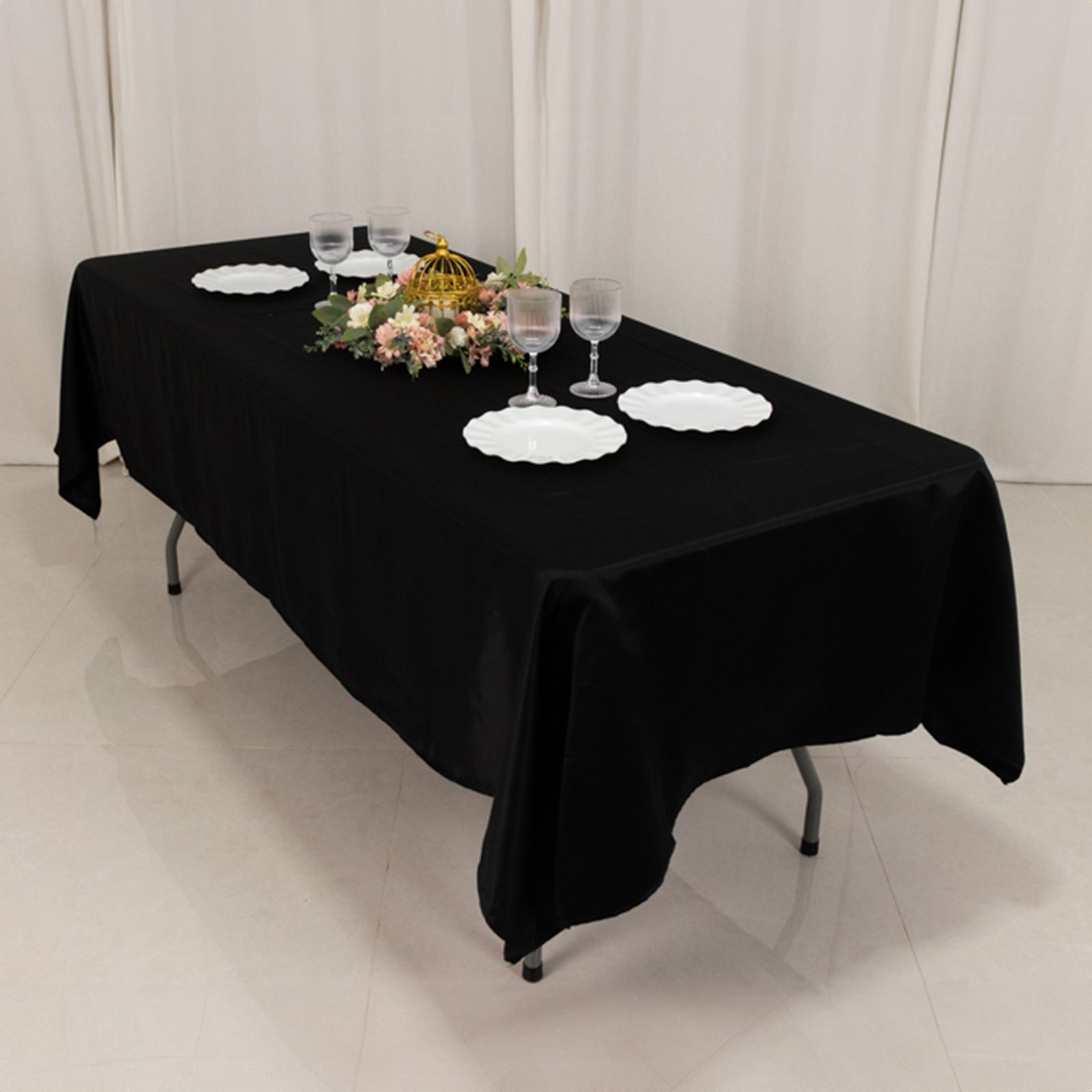 Black Lamour satin rectangle tablecloth on a dining table.