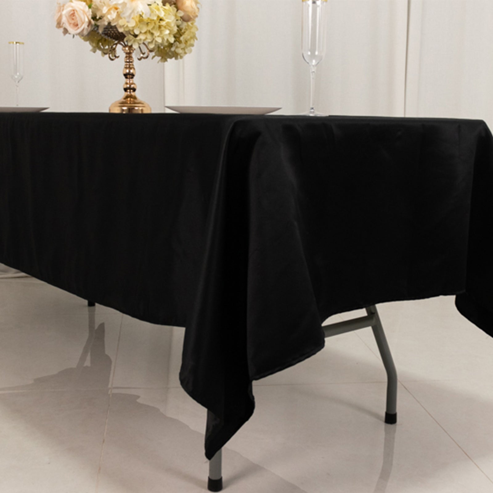 Black Lamour satin rectangle tablecloth, 60"x102" for elegant dining setups.