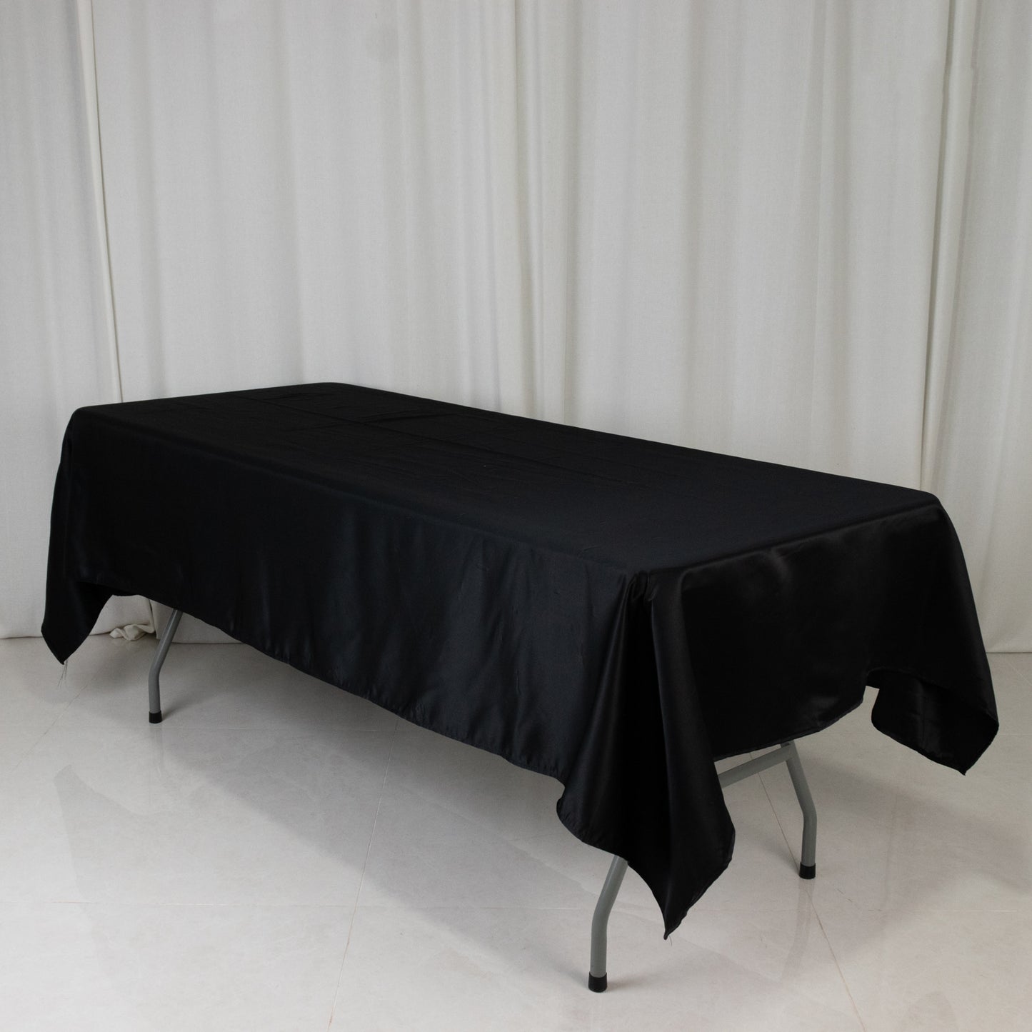 Black rectangular tablecloth, 60"x102", made of Lamour satin.
